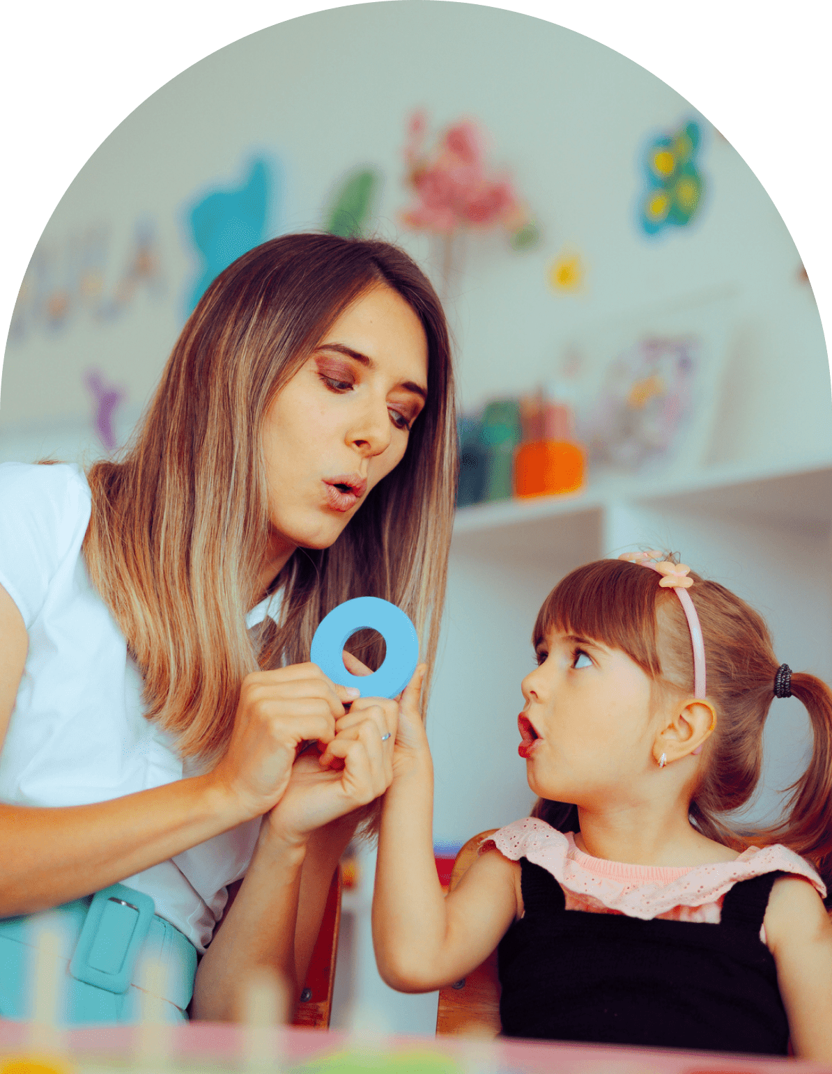 Teacher and child learning with blue circle.